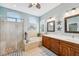 Elegant bathroom with double vanity, soaking tub, and walk-in shower at 11519 Belle Haven Dr, New Port Richey, FL 34654