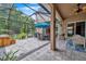 Spacious backyard oasis with covered patio, hot tub, and dining area at 11519 Belle Haven Dr, New Port Richey, FL 34654