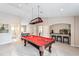 Game room featuring a pool table and built-in bar area at 11519 Belle Haven Dr, New Port Richey, FL 34654
