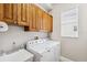 Convenient laundry room with washer, dryer, and cabinets at 11519 Belle Haven Dr, New Port Richey, FL 34654
