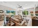 Relaxing living room with lots of natural light and sliding doors to a patio at 11519 Belle Haven Dr, New Port Richey, FL 34654