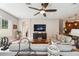 Bright living room with a ceiling fan and access to the bathroom at 11519 Belle Haven Dr, New Port Richey, FL 34654