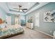 Serene bedroom with king-size bed, and views of the bathroom at 11519 Belle Haven Dr, New Port Richey, FL 34654