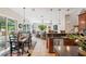 Open floorplan boasts a large kitchen and Gathering room with sliding doors to the patio at 11519 Belle Haven Dr, New Port Richey, FL 34654