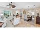 Bright living room features a comfortable seating area and views into the dining room and kitchen at 11519 Belle Haven Dr, New Port Richey, FL 34654