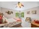 Bright bedroom with a coral-themed decor and plenty of natural light at 11519 Belle Haven Dr, New Port Richey, FL 34654