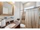Clean bathroom with shower, toilet, and vanity at 11519 Belle Haven Dr, New Port Richey, FL 34654
