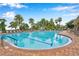 Resort-style pool with plenty of lounge chairs and a waterslide at 11519 Belle Haven Dr, New Port Richey, FL 34654