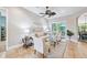 Spacious living room with tiled floors, comfy seating and sliding doors to patio at 11519 Belle Haven Dr, New Port Richey, FL 34654
