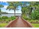 Wooden fishing pier extending over the lake at 11519 Belle Haven Dr, New Port Richey, FL 34654