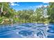 Outdoor basketball court with a newly resurfaced playing surface at 11519 Belle Haven Dr, New Port Richey, FL 34654