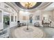 Elegant community clubhouse lobby with seating areas and access to other amenities at 11519 Belle Haven Dr, New Port Richey, FL 34654