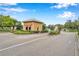Gated community entrance with guard house and landscaped areas at 11519 Belle Haven Dr, New Port Richey, FL 34654