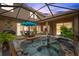 Relax in your screened-in patio hot tub, complete with outdoor dining and seating at 11519 Belle Haven Dr, New Port Richey, FL 34654