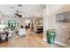 Bright living room with tiled floors, comfy seating, and dining area view at 11519 Belle Haven Dr, New Port Richey, FL 34654