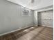 Bright basement bedroom with large closet and new flooring at 103 Brigadoon Dr, Clearwater, FL 33759