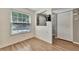 Bright dining area with wood-look floors and view to backyard at 103 Brigadoon Dr, Clearwater, FL 33759