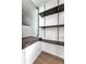 Storage room with shelving and a small bench at 103 Brigadoon Dr, Clearwater, FL 33759