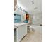 Modern bathroom with a white vanity and a tub at 103 Brigadoon Dr, Clearwater, FL 33759