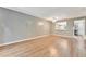 Spacious living room with wood-look floors and ceiling fan at 103 Brigadoon Dr, Clearwater, FL 33759