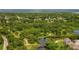 Wide aerial view showing surrounding nature and community at 103 Brigadoon Dr, Clearwater, FL 33759