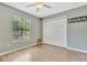 Spacious bedroom with large closet and wood-look flooring at 103 Brigadoon Dr, Clearwater, FL 33759