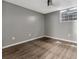 Bright bedroom with wood-look floors and gray walls at 103 Brigadoon Dr, Clearwater, FL 33759