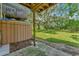 Private backyard with grassy area and trees at 103 Brigadoon Dr, Clearwater, FL 33759
