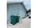 Exterior view of home with green trash cans at 6196 Coralberry Ter, Port Charlotte, FL 33981