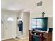 Front entry with coat rack, shoe storage and large TV at 6196 Coralberry Ter, Port Charlotte, FL 33981