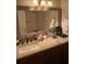 Bathroom with vanity, mirror, and large countertop at 6196 Coralberry Ter, Port Charlotte, FL 33981