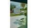 View of backyard patio and shed through screen at 6196 Coralberry Ter, Port Charlotte, FL 33981