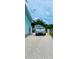Gravel driveway and side yard with storage shed at 6196 Coralberry Ter, Port Charlotte, FL 33981