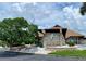 Gardens of Gulf Cove clubhouse with stone facade at 6196 Coralberry Ter, Port Charlotte, FL 33981