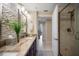 The bathroom features double sinks, decorative stone, and a modern shower at 1540 Gulf Blvd # 2102, Clearwater Beach, FL 33767
