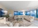 Comfortable living room boasting stylish furnishings, including ocean views and a plush sectional sofa at 1540 Gulf Blvd # 2102, Clearwater Beach, FL 33767