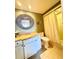 Charming bathroom with vanity, decorative mirror, and shower, providing a comfortable space at 2618 Gulf Blvd # 505, Indian Rocks Beach, FL 33785
