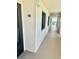 Hallway leading to unit 505, featuring windows and an ocean view at the end at 2618 Gulf Blvd # 505, Indian Rocks Beach, FL 33785