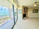 Cozy living area featuring a fireplace, balcony access, and serene ocean views, perfect for relaxation at 2618 Gulf Blvd # 505, Indian Rocks Beach, FL 33785
