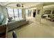 Inviting living room featuring tile floors, comfortable seating, and access to a scenic balcony at 2618 Gulf Blvd # 505, Indian Rocks Beach, FL 33785