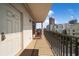 Balcony view of the city with tiled floor, metal railings, and partial building view at 341 5Th S St # 4, St Petersburg, FL 33701