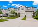 Townhouse exterior with two-car garage and landscaping at 7203 Sweet Alyssum Ct, Tampa, FL 33619