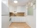 Newly renovated kitchen with white cabinets and new appliances at 2391 Sumatran Way # 55, Clearwater, FL 33763
