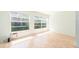 Bright bedroom with light wood flooring and large windows at 2391 Sumatran Way # 55, Clearwater, FL 33763