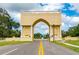 Grand entrance with a large arch and globe centerpiece at 2391 Sumatran Way # 55, Clearwater, FL 33763
