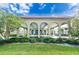Community clubhouse with covered entryway and landscaping at 2391 Sumatran Way # 55, Clearwater, FL 33763