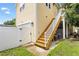 Wooden staircase leading to upper level of yellow house at 2430 6Th N Ave, St Petersburg, FL 33713