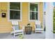 Front porch with two white chairs and small table at 2430 6Th N Ave, St Petersburg, FL 33713
