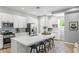 Modern kitchen with white cabinets, large island, and stainless steel appliances at 2430 6Th N Ave, St Petersburg, FL 33713