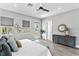 Main bedroom with king-size bed, ceiling fan, and access to balcony at 2430 6Th N Ave, St Petersburg, FL 33713